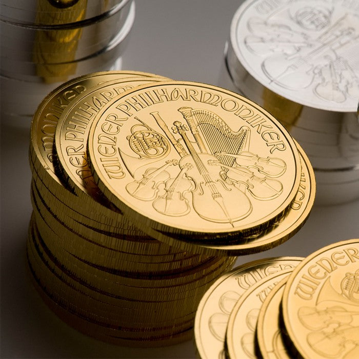 Austrian Philharmonic gold and silver coins stacked