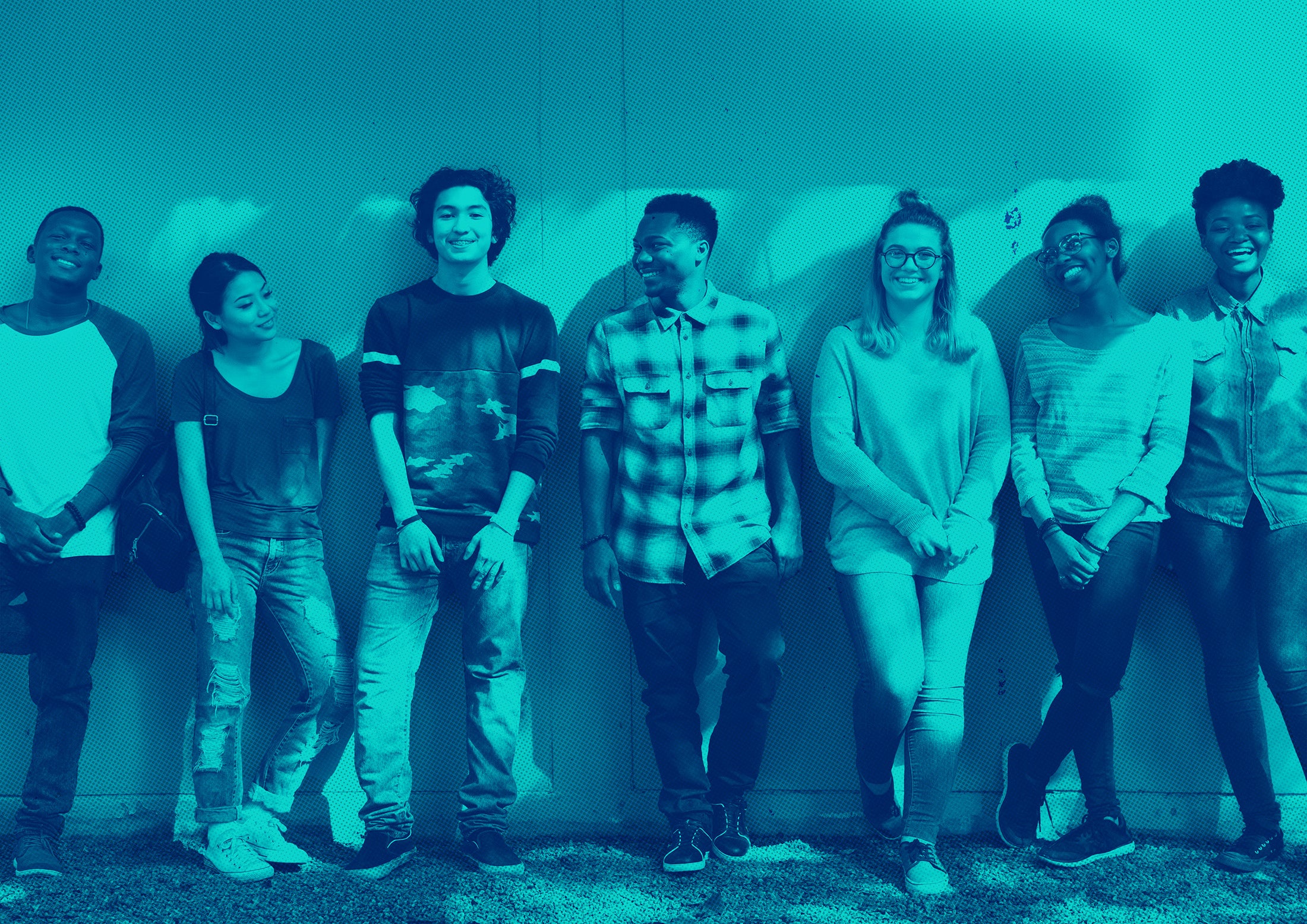 Group of young people standing together against a light-colored wall with a blue filter