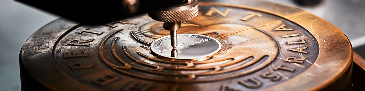 A medallion being engraved at the Perth Mint