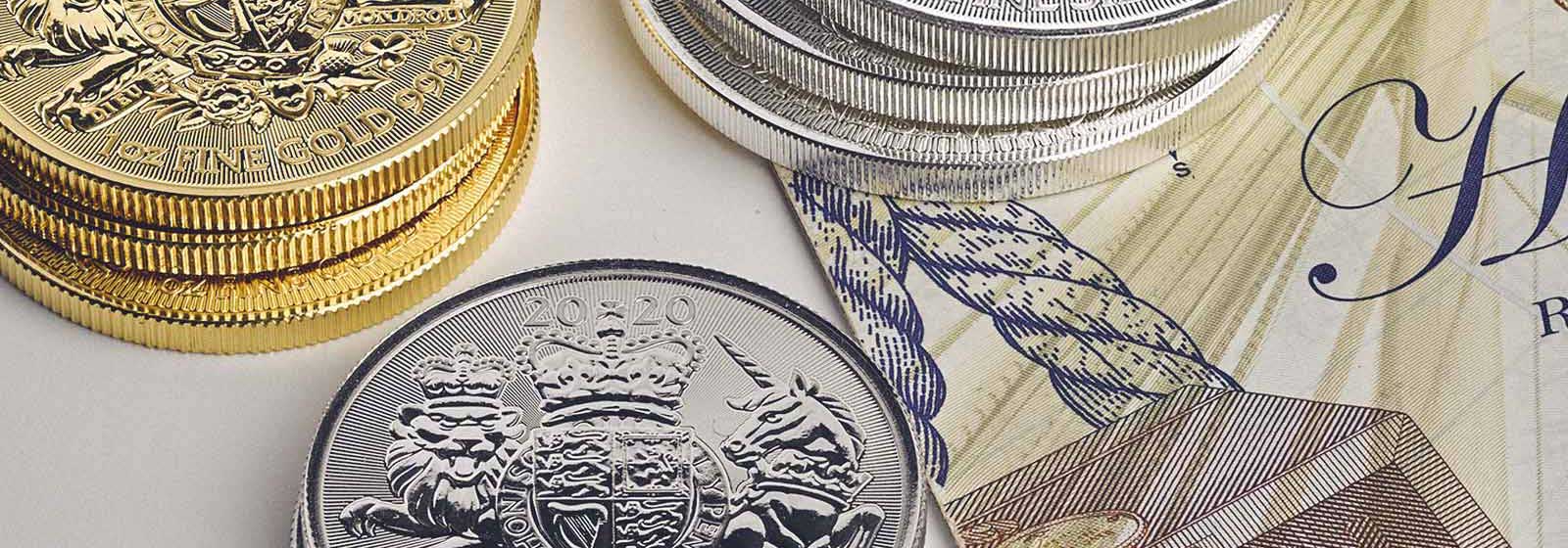 Royal Mint gold and silver coins with a banknote